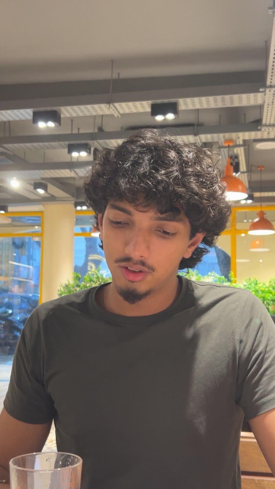 Krish Thakker sitting at a table